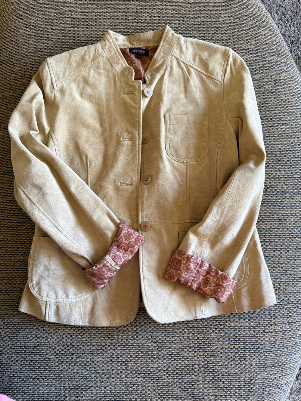 Beige suede leather woman’s jacket.